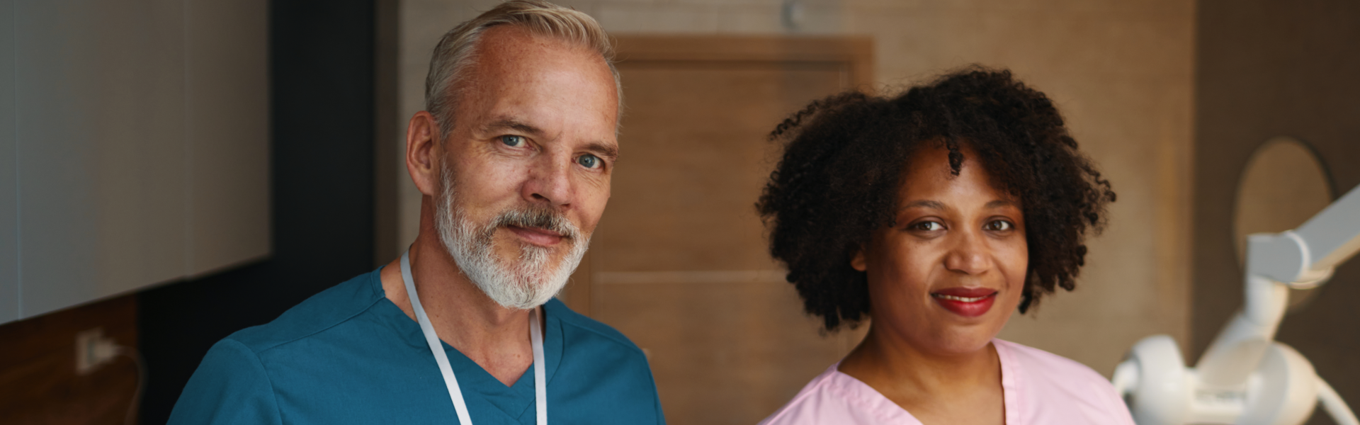 two caregivers smiling