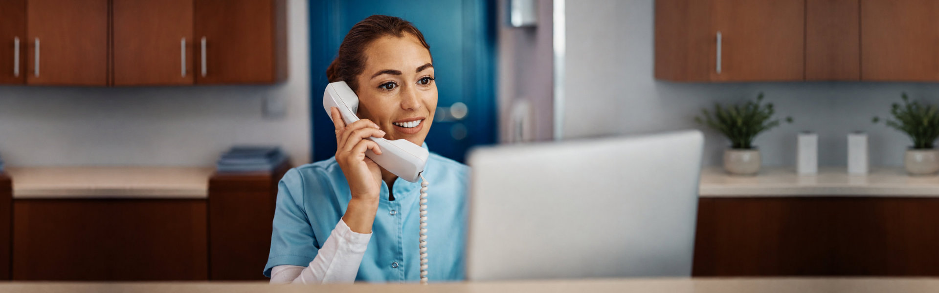 Young nurse answering phone call
